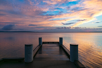 Wharf on lake early morning at sunrise