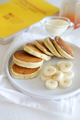 Delicious and fluffy pancakes for breakfast with banana and condensed milk.
