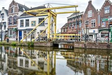 Fototapeta na wymiar The Fortegracht bridge Maassluis, in street view. Netherlands, Holland, Europe