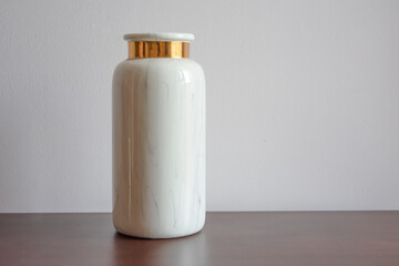 White marble flower vase with golden accent