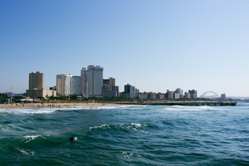 Ocean, coast and city skyline of Durban, South Africa.