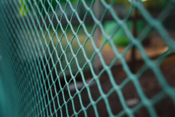 The green fence net is taken close by. Mesh texture