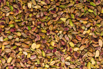 Peeled tasty pistachios as a background.