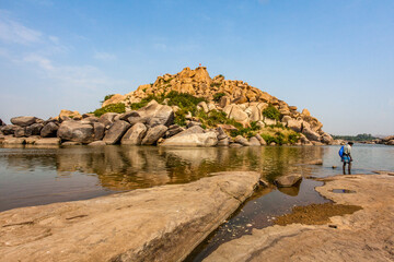 Fototapeta na wymiar Big boulders and rocks along the Chakrairtha Lake in Hampi, Karnataka, South India - Asia