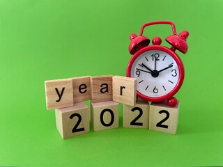 alarm clock and year 2022 text