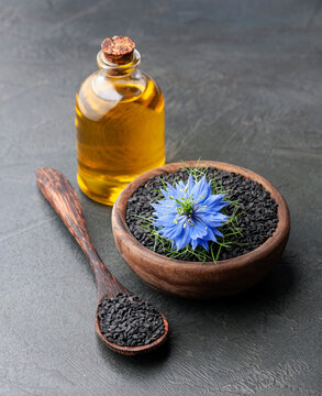 Oil of black cumin seed and nigella sativa flowers