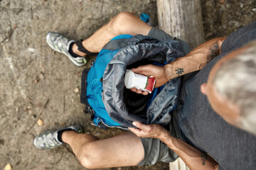 Top view of caucasian man holding snack pack