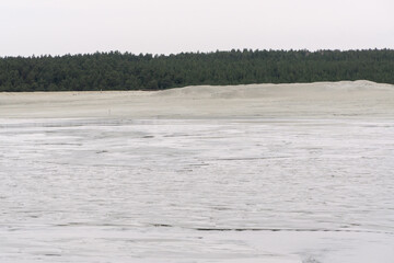 discharge of fine sand into the tailing dump