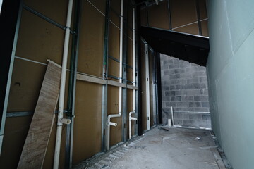 Interior of brewery, large steel storage tanks for brewing beer with metal pipes and valves. in...