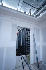 Interior Render from construction, Metal frame of the new building against the roof