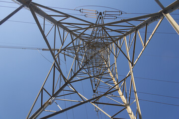 Power lines during a beautiful sunset. Electricity transportation on beautiful landscapes of the world.