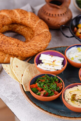 Traditional Turkish breakfast with meze and simit