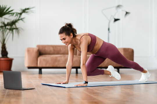 Young Woman Doing Cross Body Mountain Climbers Exercise