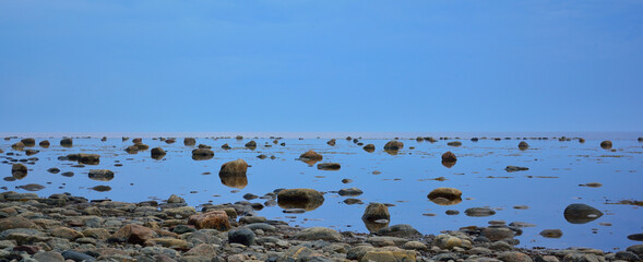 coast
low tide
blue sky