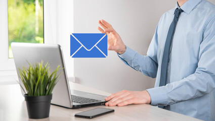 Businessman hand holding e-mail icon, Contact us by newsletter email and protect your personal...