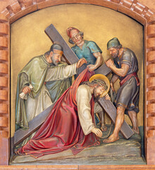 VIENNA, AUSTIRA - JUNI 18, 2021: The relief of Jesus fall under the cross in the Herz Jesu church from begin of 20. cent. by Workroom from Munich.