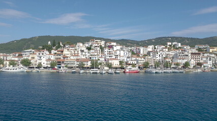 Skiathos Island, Greece - June 2020. View of the city of Skiathos by a boat.