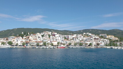 Skiathos Island, Greece - June 2020. View of the city of Skiathos by a boat.