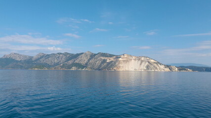 Fototapeta na wymiar View of the mountains of an Aegean Island in Greece. Shooting from water.