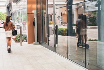 person in the street reflection people woman city urban building 