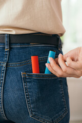disposable electronic cigarettes in pants pocket close-up