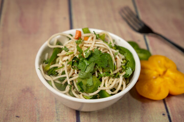 tasty noodles with coriander and vegetables