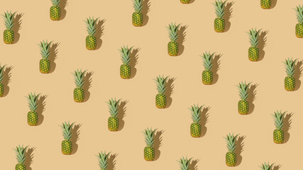 Creative summer vibes concept with fresh raw pineapple on pastel beige background. Minimalistic...