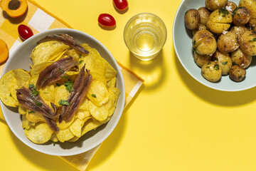 Assortment of potato, fried, cooked, chips and french fries snacks