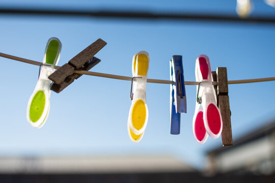 Clothesline Pegs hanging on a sunny morning