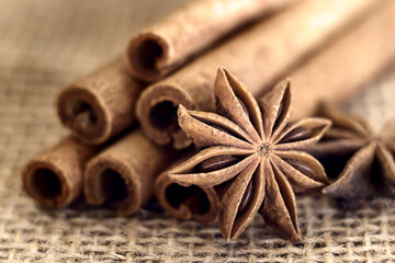 cinnamon sticks and star anise on burlap close-up.  Photo. macro