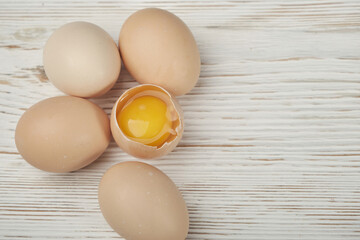 Close-up view of raw chicken on wooden background. Raw chicken eggs in egg box organic food for good health high protein .