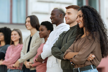 International group of cheerful students holding hands