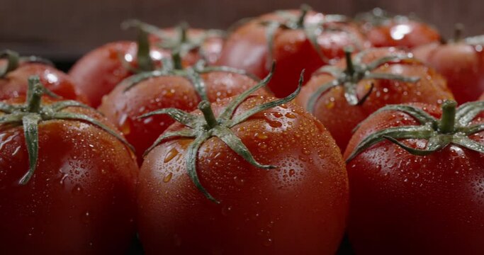 Juicy tasty fresh tomatoes on chef's table. Freshly washed organic vegetables straight from the farm. Healthy vegetarian products close up 4k footage