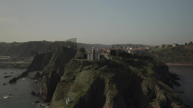 Aerial video view of the port, the lighthouse and the town of Cand&aacute;s, Asturias. Spain.