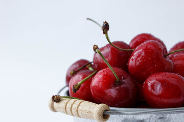 Fresh ripe organic cherry in a metal bucket, bucket of cherries, cherries in a bucket, cherries in drops, cherries in a metal bucket, cherry in a metal bucket on a white background, cherries, 