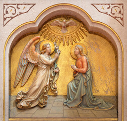 VIENNA, AUSTIRA - JUNI 18, 2021: The relief of Annunciation on the altar of Herz Jesu church from begin of 20. cent.