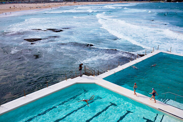 Swimmers at Bondi Icebergs pool with Bondi Beach behind