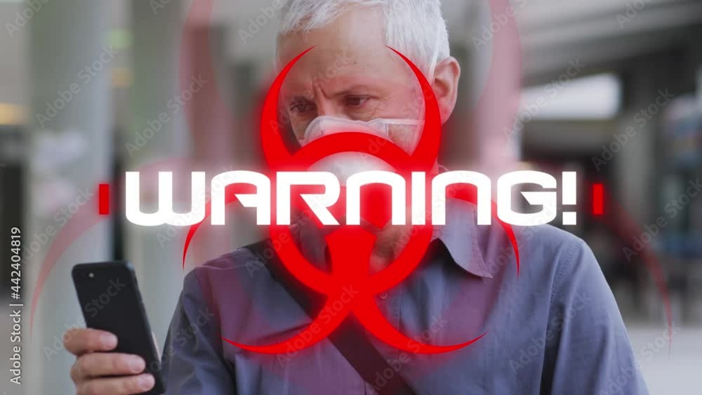 Poster animation of text warning with biohazard symbol, over man in face mask using smartphone in street
