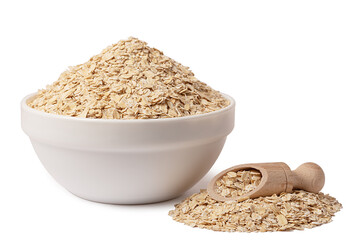A bowl of dry oatmeal. Healthy, simple breakfast. Wooden scoop.