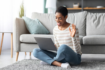 Obraz premium Online Meeting. Cheerful African Female With Laptop Making Video Call At Home