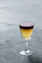 New York Whiskey Sour in crystal wine glass with red wine float