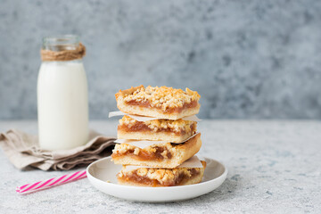 Homemade berry crumble bars with jam, homemade cookies with milk