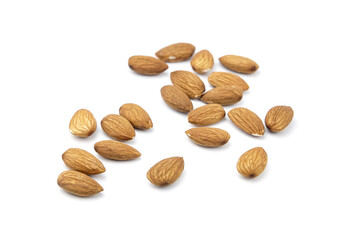 Almond nuts isolated on white background. Heap of scattered almonds