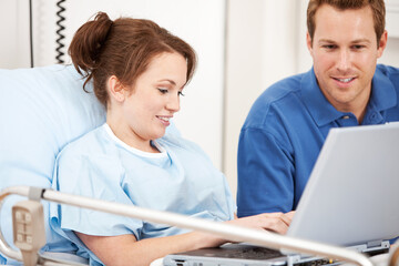 Hospital: Couple Using Laptop in Hospital