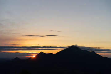 Obraz premium Mountain Landscape. Panoramic View Of Mountains Against Sky During Sunset