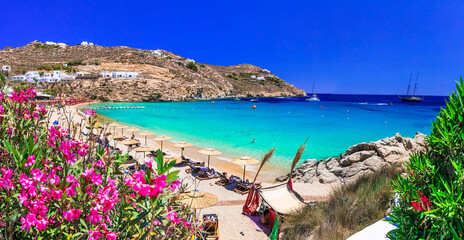 Greece summer vacation. Luxury greek holidays. Stunning Mykonos island. famous Super Paradise beach with  turquoise sea - obrazy, fototapety, plakaty