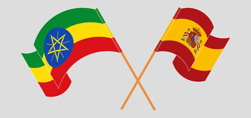 Crossed and waving flags of Ethiopia and Spain