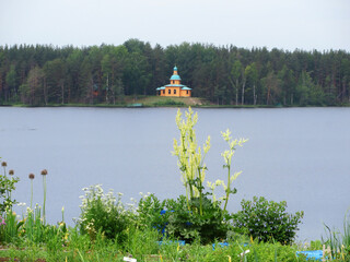 Church of Panteleimon in the distance on the Roshchinskoe lake in summer. Alexander Svirsky...