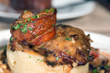 Delicious chicken and couscous with dried fruits. Traditional Moroccan cuisine. Close-up.