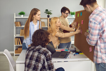 School, college or university students working on group project. Creative schoolmates meeting in...